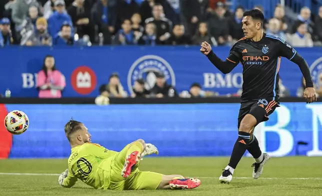 CF Montreal goalkeeper Jonathan Sirois (40) stops New York City FC's Alonso Martinez during first half MLS soccer action in Montreal, Saturday, October 19, 2024. (Graham Hughes/The Canadian Press via AP)