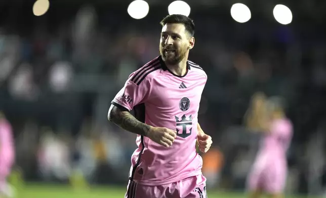 Inter Miami forward Lionel Messi reacts after scoring a goal during the second half of an MLS soccer match against the New England Revolution, Saturday, Oct. 19, 2024, in Fort Lauderdale, Fla. (AP Photo/Lynne Sladky)