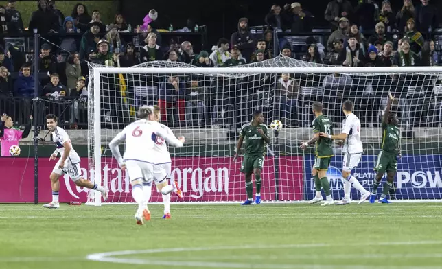 Vancouver Whitecaps forward Brian White, left, smiles after his goal during the first half oa an MLS playoff match against the Portland Timbers on Wednesday, Oct. 23, 2024 in Portland, Ore. (Sean Meagher/The Oregonian via AP)