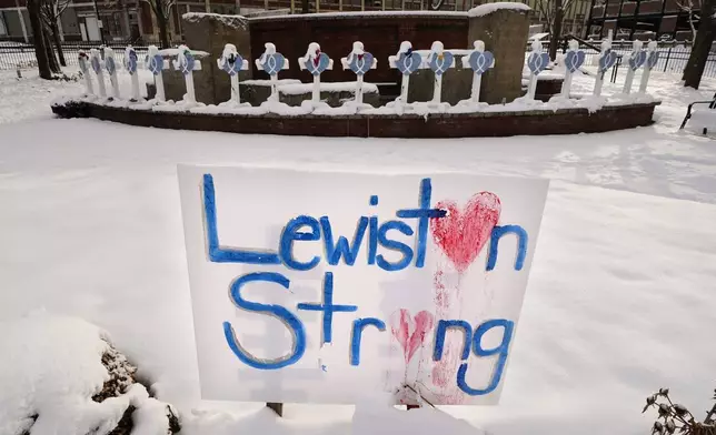 FILE - Snow coats crosses at one of several memorials for the victims of last month's mass shooting in Lewiston, Maine, in this Tuesday, Dec. 5, 2023 file photo. (AP Photo/Robert F. Bukaty, File)