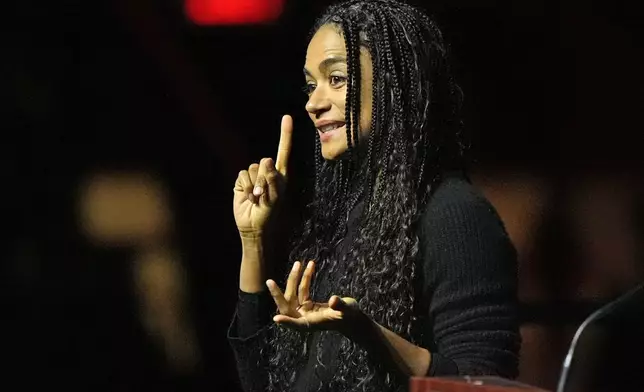 Actress Lauren Ridloff communicates through sign language at a commemoration event to mark the one year anniversary of the mass shooting in Lewiston, Maine, Friday, Oct. 25, 2024. (AP Photo/Robert F. Bukaty)