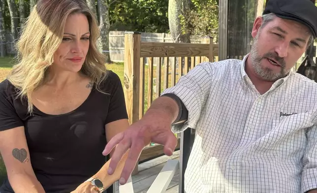 Lewiston mass shooting survivor Ben Dyer and fiancée Keela Smith show Dyer's injuries from the 2023 massacre and talk about their plans for the future on Wednesday, Oct. 3, 2024 in Auburn, Maine. (AP Photo/Nick Perry)