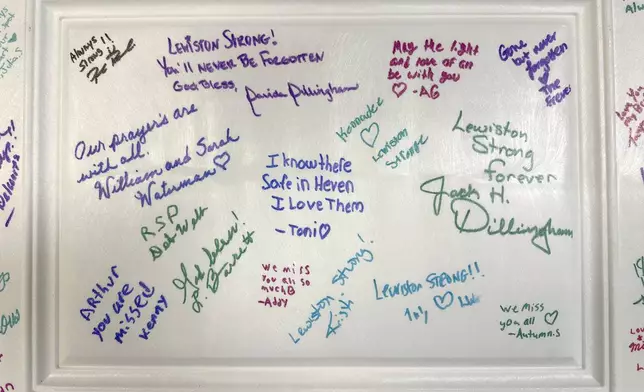 Messages are written on the cover of a time capsule at a commemoration event to mark the one year anniversary of a mass shooting in Lewiston, Maine, Friday, Oct. 25, 2024. (AP Photo/Robert F. Bukaty)