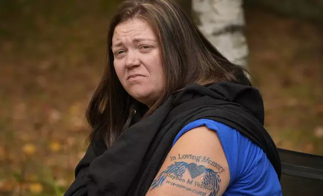 Megan Vozzella shows a tattoo she got in memory of her late husband, Stephen Vozzella, who was one of the people killed in a mass shooting on Oct. 25, 2023, in Lewiston, Tuesday, Oct. 1, 2024, in Oxford, Maine. (AP Photo/Robert F. Bukaty)