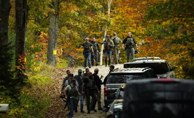 FILE - Law enforcement continue a manhunt in the aftermath of a mass shooting, in Durham, Maine, Oct. 27, 2023. (AP Photo/Matt Rourke, File)