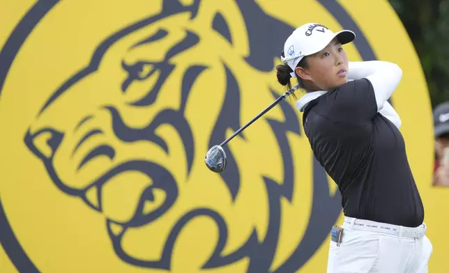 Yin Ruoning of China watches her tee shot on the 16th hole during the LPGA Tour's Maybank Championship at Kuala Lumpur Golf and Country club in Kuala Lumpur, Sunday, Oct. 27, 2024. (AP Photo/Vincent Thian)