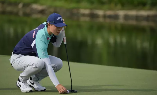 Yuka Saso of Japan lines up a putt on the 2nd green during the first round of Maybank LPGA Championship golf tournament at Kuala Lumpur Golf and Country club in Kuala Lumpur, Thursday, Oct. 24, 2024. (AP Photo/Vincent Thian)