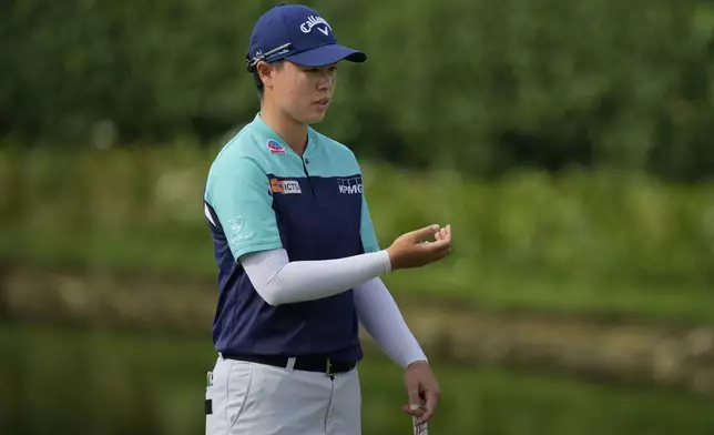 Yuka Saso of Japan lines up a putt on the 2nd green during the first round of Maybank LPGA Championship golf tournament at Kuala Lumpur Golf and Country club in Kuala Lumpur, Thursday, Oct. 24, 2024. (AP Photo/Vincent Thian)