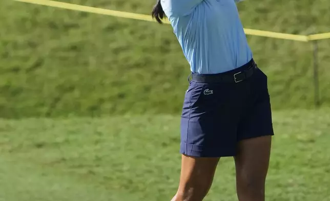 Celine Boutier of France watches her fairway shot on the third hole during the second round of Maybank LPGA Championship golf tournament at Kuala Lumpur Golf and Country club in Kuala Lumpur, Thursday, Oct. 24, 2024. (AP Photo/Vincent Thian)