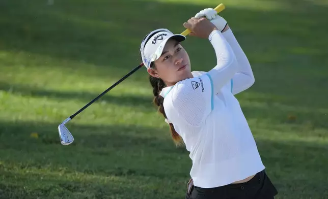 Jeeno Thitikul of Thailand watches her fairway shot on the third hole during the second round of Maybank LPGA Championship golf tournament at Kuala Lumpur Golf and Country club in Kuala Lumpur, Thursday, Oct. 24, 2024. (AP Photo/Vincent Thian)