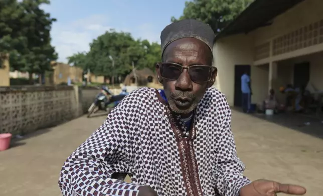 Adama Bagayoko, director of the theater troupe that has been performing with patients at the psychiatric ward of the Point G hospital, stands in the hospital's courtyard in Bamako, Mali, Friday, Sept. 20, 2024. (AP Photo/Moustapha Diallo)