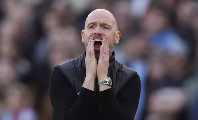 Manchester United manager Erik ten Hag reacts on the touchline during the English Premier League soccer match between West Ham United and Manchester United at the London Stadium in London, Sunday, Oct. 27, 2024. (John Walton/PA via AP)