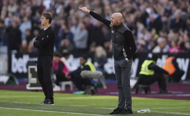 FILE - Manchester United manager Erik ten Hag gestures during the English Premier League soccer match between West Ham United and Manchester United at the London Stadium in London, Sunday, Oct. 27, 2024. (John Walton/PA via AP, File)