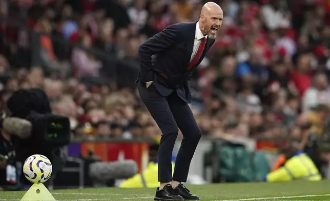 FILE - Manchester United's head coach Erik ten Hag shouts out from the touchline during the English Premier League soccer match between Manchester United and Fulham at Old Trafford, Friday, Aug. 16, 2024, in Manchester, England. (AP Photo/Dave Thompson, File)