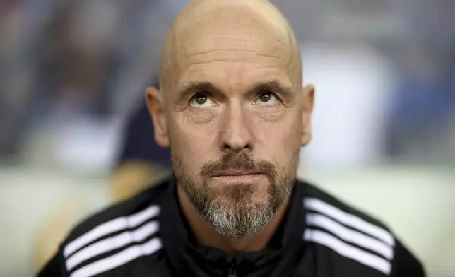 FILE - Manchester United's head coach Erik ten Hag sits on the bench during a Europa League opening phase soccer match between FC Porto and Manchester United at the Dragao stadium in Porto, Portugal, Thursday, Oct. 3, 2024. (AP Photo/Luis Vieira, File)