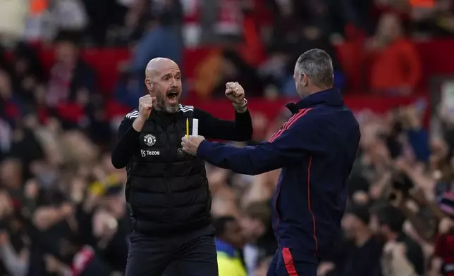 FILE - Manchester United's head coach Erik ten Hag, left, celebrates after Manchester United's Rasmus Hojlund scoring his side's second goal during the English Premier League soccer match between Manchester United and Brentford at Old Trafford stadium in Manchester, England, Saturday, Oct. 19, 2024. (AP Photo/Dave Thompson, File)