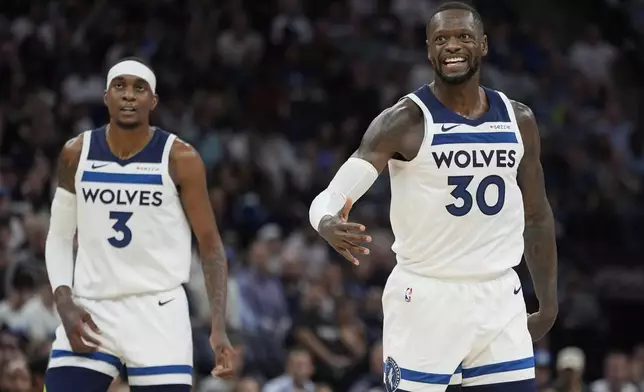 Minnesota Timberwolves forward Julius Randle (30) reacts after missing a shot during the first half of an NBA basketball game against the Dallas Mavericks, Tuesday, Oct. 29, 2024, in Minneapolis. (AP Photo/Abbie Parr)