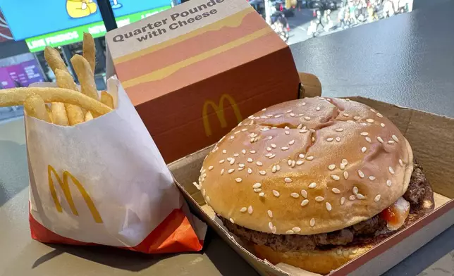 A McDonald's Quarter Pounder hamburger and fries are shown in this photograph, in New York's Times Square, Wednesday, Oct. 23, 2024. (AP Photo/Richard Drew)