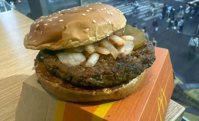 A McDonald's Quarter Pounder hamburger is shown in this photograph, in New York's Times Square, Wednesday, Oct. 23, 2024. (AP Photo/Richard Drew)