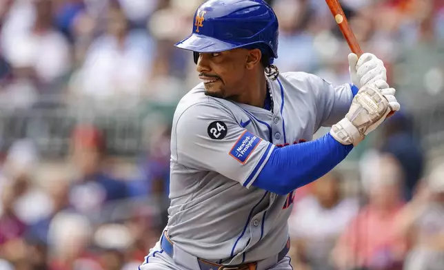 New York Mets' Francisco Lindor prepares to swing in the third inning of a baseball game against the Atlanta Braves, Monday, Sept. 30, 2024, in Atlanta. (AP Photo/Jason Allen)