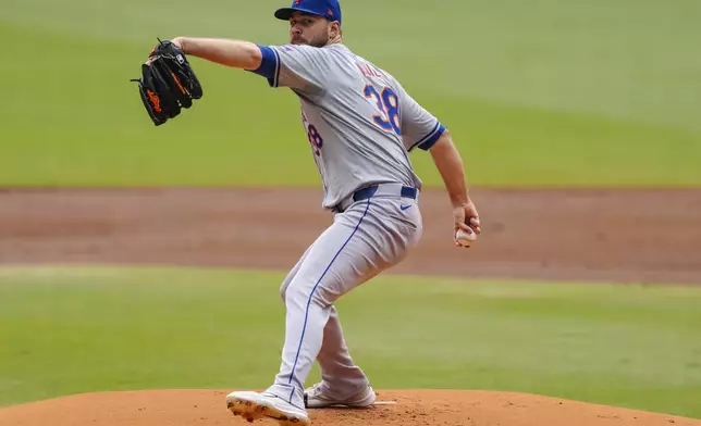 New York Mets pitcher Tylor Megill throws in the first inning of a baseball game against the Atlanta Braves, Monday, Sept. 30, 2024, in Atlanta. (AP Photo/Jason Allen)