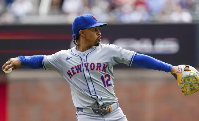 New York Mets shortstop Francisco Lindor throws to first base in the third inning of a baseball game against the New York Mets, Monday, Sept. 30, 2024, in Atlanta. (AP Photo/Jason Allen)