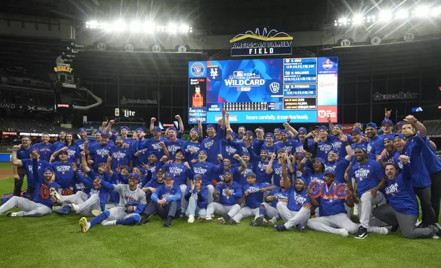 The New York Mets celebrate after winning Game 3 of a National League wild card baseball game against the Milwaukee Brewers Thursday, Oct. 3, 2024, in Milwaukee. The Mets won 4-2. (AP Photo/Morry Gash)