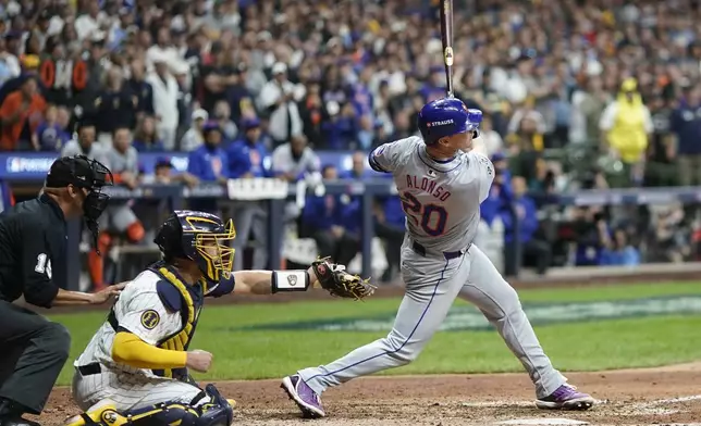 New York Mets' Pete Alonso hits a three-run home run during the ninth inning of Game 3 of a National League wild card baseball game against the Milwaukee Brewers Thursday, Oct. 3, 2024, in Milwaukee. (AP Photo/Morry Gash)