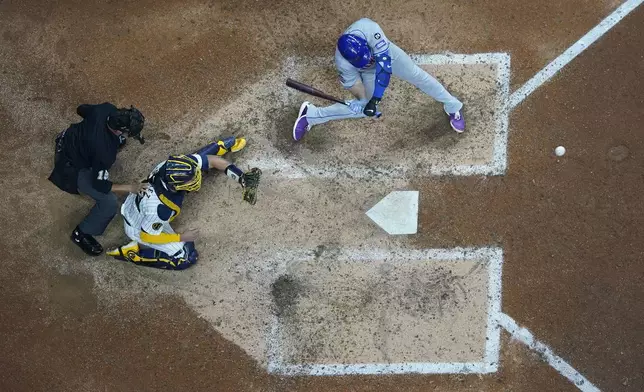 New York Mets' Pete Alonso hits a three-run home run during the ninth inning of Game 3 of a National League wild card baseball game against the Milwaukee Brewers Thursday, Oct. 3, 2024, in Milwaukee. (AP Photo/Morry Gash)