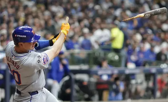 New York Mets' Pete Alonso hits a broken-bat single during the seventh inning of Game 2 of a National League wild card baseball game against the Milwaukee Brewers Wednesday, Oct. 2, 2024, in Milwaukee. (AP Photo/Morry Gash)