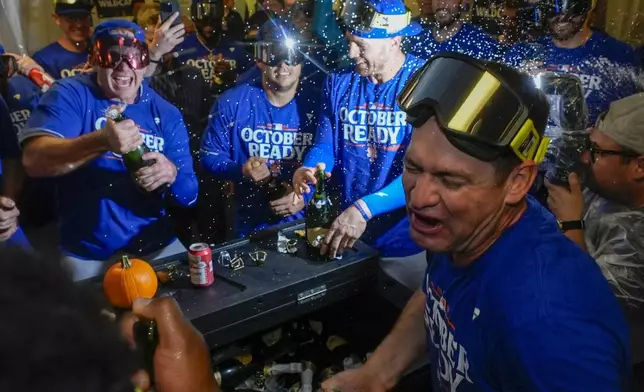 The New York Mets celebrate after winning Game 3 of a National League wild card baseball game against the Milwaukee Brewers Thursday, Oct. 3, 2024, in Milwaukee. The Mets won 4-2. (AP Photo/Morry Gash)