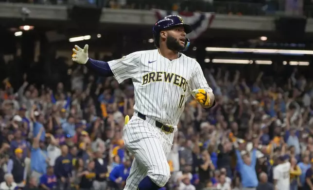 Milwaukee Brewers' Jackson Chourio reacts after hitting a home run during the eighth inning of Game 2 of a National League wild card baseball game against the New York Mets Wednesday, Oct. 2, 2024, in Milwaukee. (AP Photo/Morry Gash)