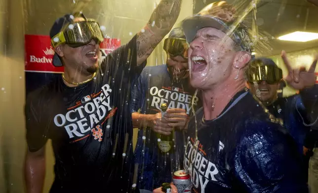 New York Mets' Pete Alonso celebrates with teammates after winning Game 3 of a National League wild card baseball game against the Milwaukee Brewers Thursday, Oct. 3, 2024, in Milwaukee. The Mets won 4-2. (AP Photo/Morry Gash)