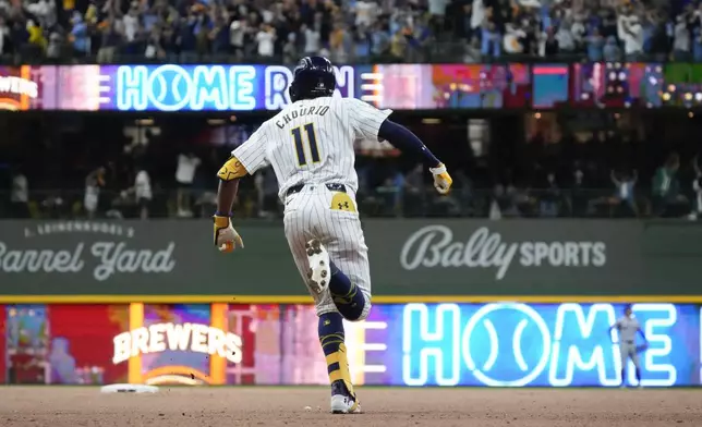 Milwaukee Brewers' Jackson Chourio reacts after hitting a home run during the eighth inning of Game 2 of a National League wild card baseball game against the New York Mets Wednesday, Oct. 2, 2024, in Milwaukee. (AP Photo/Morry Gash)