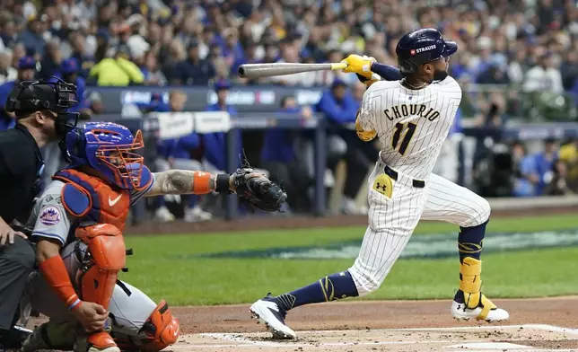 Milwaukee Brewers' Jackson Chourio hits a home run during the first inning of Game 2 of a National League wild card baseball game against the New York Mets Wednesday, Oct. 2, 2024, in Milwaukee. (AP Photo/Morry Gash)