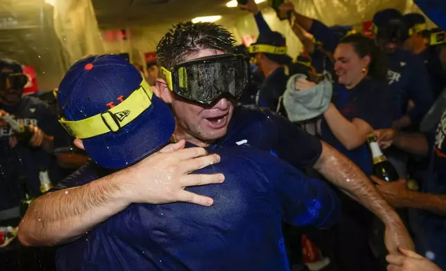 New York Mets manager Carlos Mendoza celebrates after winning Game 3 of a National League wild card baseball game against the Milwaukee Brewers Thursday, Oct. 3, 2024, in Milwaukee. The Mets won 4-2. (AP Photo/Morry Gash)