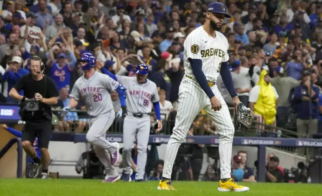 Milwaukee Brewers pitcher Devin Williams reacts after giving up a three-run home run to New York Mets' Pete Alonso during the ninth inning of Game 3 of a National League wild card baseball game Thursday, Oct. 3, 2024, in Milwaukee. (AP Photo/Morry Gash)