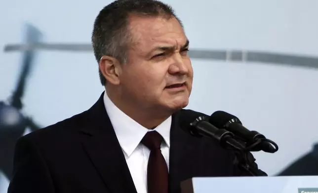 FILE - Mexico's Genaro Garcia Luna speaks during a ceremony to designate June 2 as Federal Police Day in Mexico City, June 2, 2011. (AP Photo/Alexandre Meneghini, File)