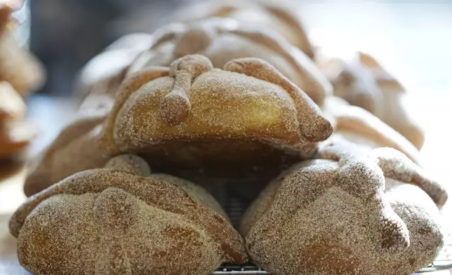 Pan de muerto, or "bread of the dead," traditional for Mexico's Day of the Dead, sits for sale at a bakery in the San Rafael neighborhood of Mexico City, Thursday, Oct. 17, 2024. (AP Photo/Fernando Llano)