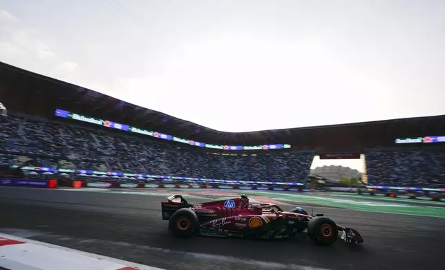 Ferrari driver Carlos Sainz, of Spain, steers his car during the second free practice ahead of the Formula One Mexico Grand Prix auto race at the Hermanos Rodriguez racetrack in Mexico City, Friday, Oct. 25, 2024. (AP Photo/Moises Castillo)