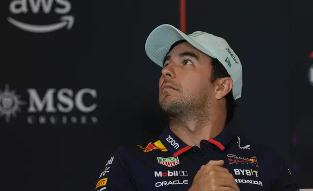 Red Bull driver Sergio Perez of Mexico looks up during a press conference at Hermanos Rodriguez racetrack ahead of the Formula One Mexico Grand Prix in Mexico City, Thursday, Oct. 24, 2024. (AP Photo/Moises Castillo)