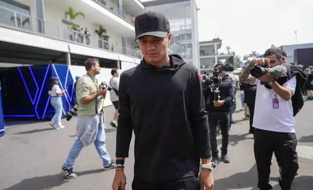 McLaren driver Lando Norris of Britain arrives to the Hermanos Rodriguez racetrack ahead of the Formula One Mexico Grand Prix auto race in Mexico City, Thursday, Oct. 24, 2024. (AP Photo/Moises Castillo)