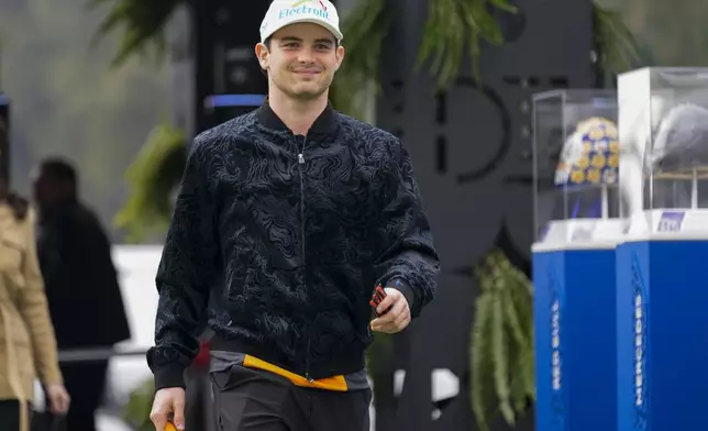 McLaren driver Pato O'Ward, of Mexico, arrives for the first free practice ahead of the Formula One Mexico Grand Prix auto race at the Hermanos Rodriguez racetrack in Mexico City, Friday, Oct. 25, 2024. (AP Photo/Moises Castillo)