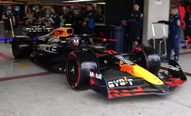 Red Bull driver Sergio Perez of Mexico leaves the pits during the third free practice ahead of the Formula One Mexico Grand Prix auto race at the Hermanos Rodriguez racetrack in Mexico City, Saturday, Oct. 26, 2024. (AP Photo/Moises Castillo)