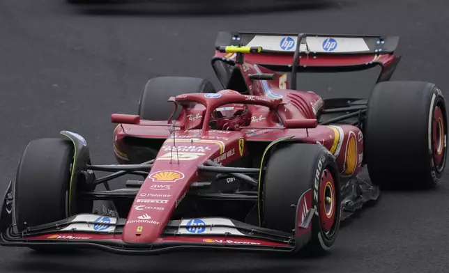 Carlos Sainz, of Spain, steers his Ferrari during the Formula One Mexico Grand Prix auto race at the Hermanos Rodriguez racetrack in Mexico City, Sunday, Oct. 27, 2024. (AP Photo/Eduardo Verdugo)