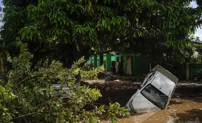 A vehicle lies damaged after Hurricane John passed through Coyuca de Benitez, Guerrero state, Mexico, Monday, Sept. 30, 2024. (AP Photo/Felix Marquez)