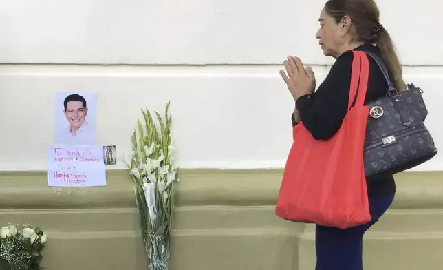 A supporter of slain Mayor Alejandro Arcos prays at the entrance of the municipal building one week after he took office in Chilpancingo, Mexico, Monday, Oct. 7, 2024. (AP Photo/Alejandrino Gonzalez)