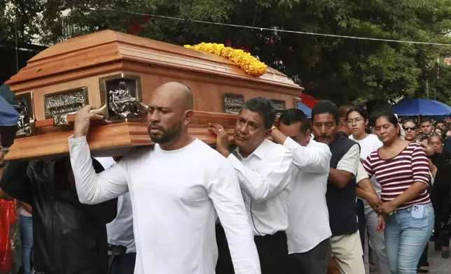 Relatives of slain Mayor Alejandro Arcos carry his coffin during his funeral service, one week after he took office, in Chilpancingo, Guerrero state, Mexico, Monday, Oct. 7, 2024. (AP Photo/Alejandrino Gonzalez)