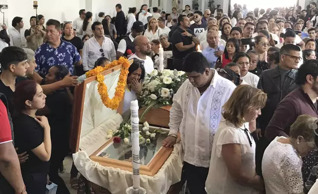 Supporters of slain Mayor Alejandro Arcos attend his funeral Mass one week after he took office, in Chilpancingo, Mexico, Monday, Oct. 7, 2024. (AP Photo/Alejandrino Gonzalez)