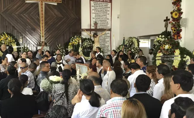 Supporters of slain Mayor Alejandro Arcos attend his funeral Mass one week after he took office, in Chilpancingo, Mexico, Monday, Oct. 7, 2024. (AP Photo/Alejandrino Gonzalez)